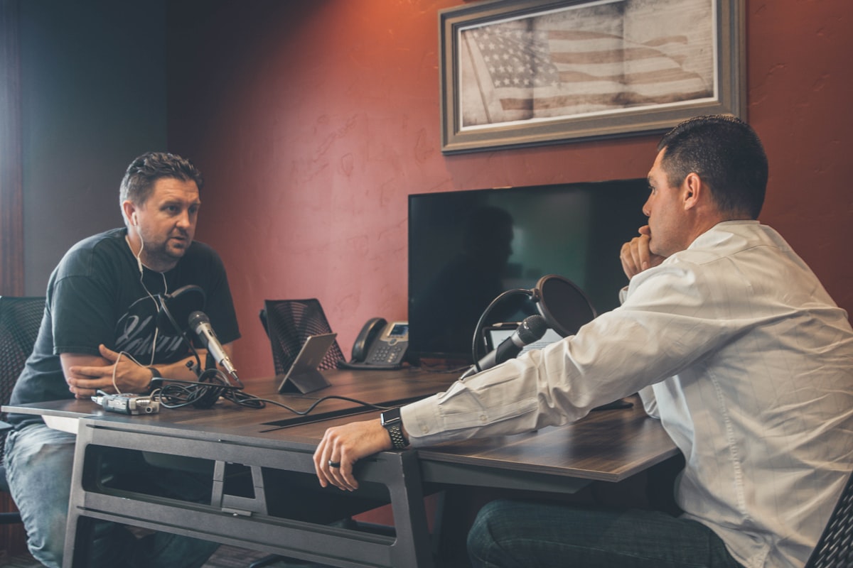 Two developers sitting across from each other in an interview setting — the ritual that no longer matches how iOS apps are actually built in 2026
