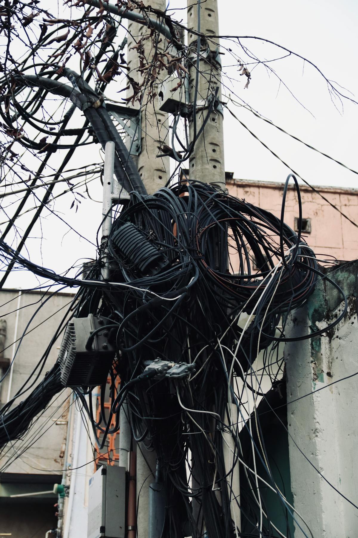 Tangled power lines and wires against a clear sky — a visual metaphor for Swift's growing language complexity and tangled feature set