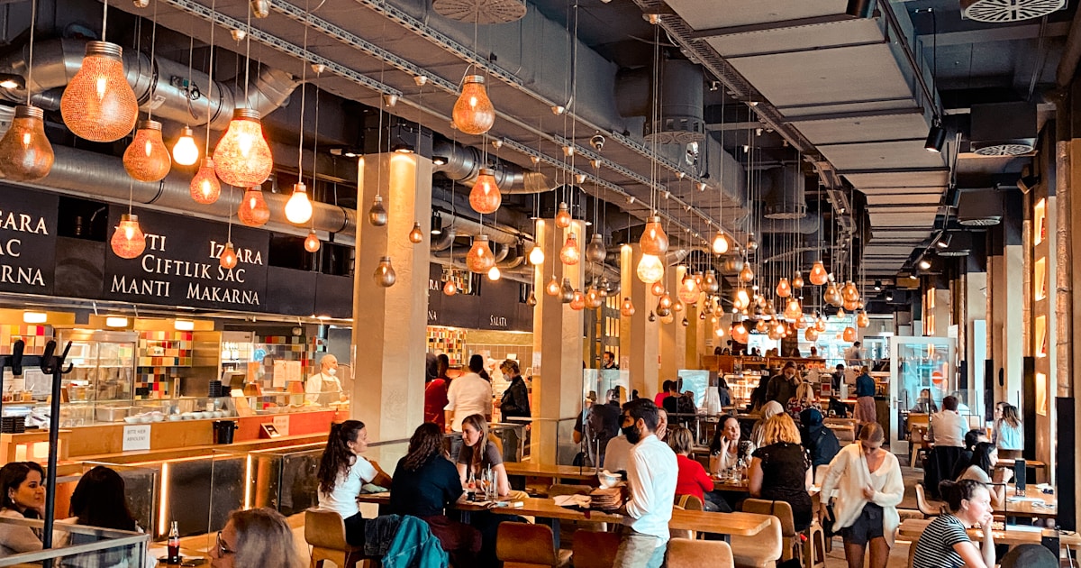A Zurich tram at night with motion blur and city lights — the setting where ThinkBud was born